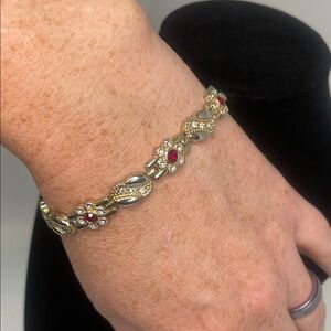 Gold and Silver Tone Floral Bracelet with Red & White Rhinestones. 7.5”